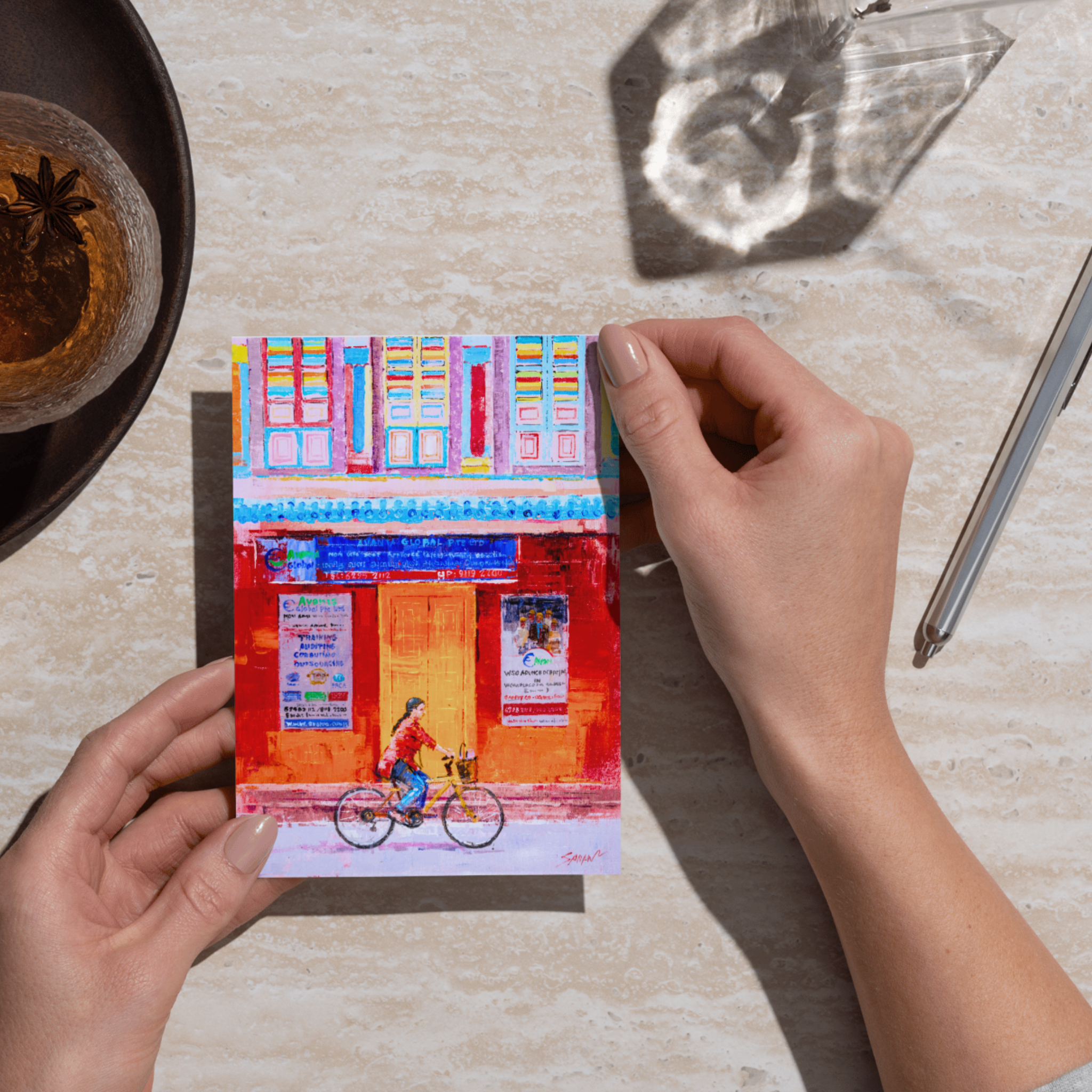 An Indian Lady Riding a Bicycle  through Little India Card - a curated painting