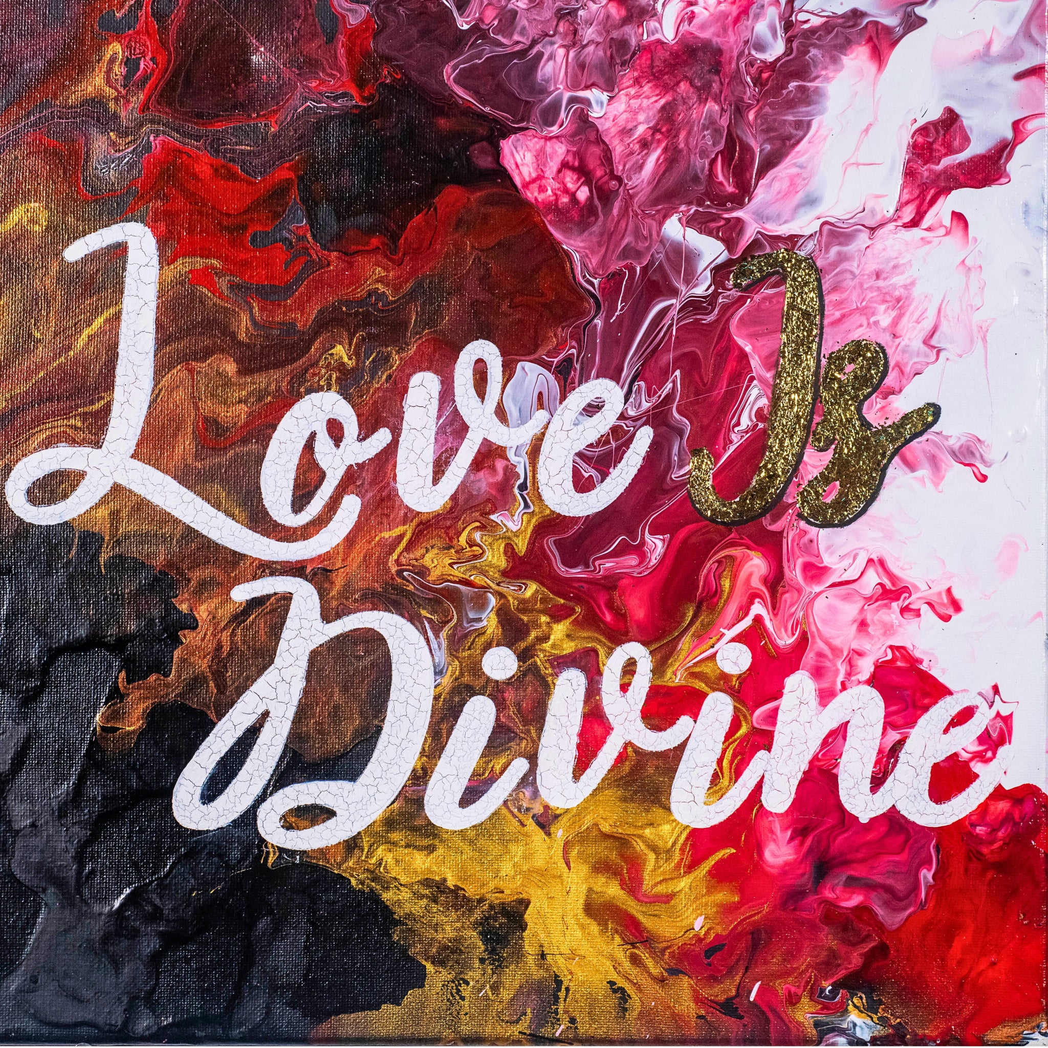 Colorful abstract painting with 'Love is Divine' text